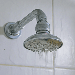 Clogged pipes reducing water pressure